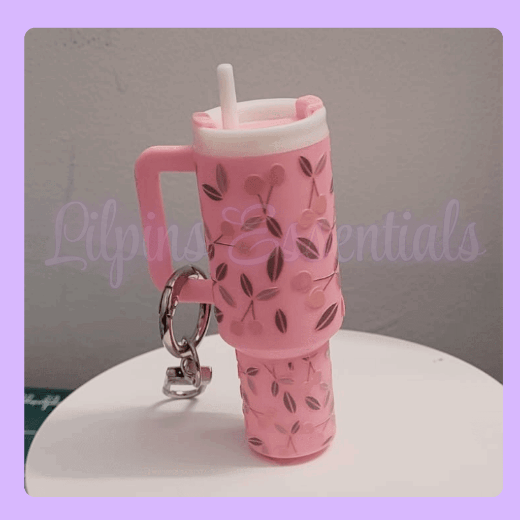 Pink mini bottle keychain with floral design