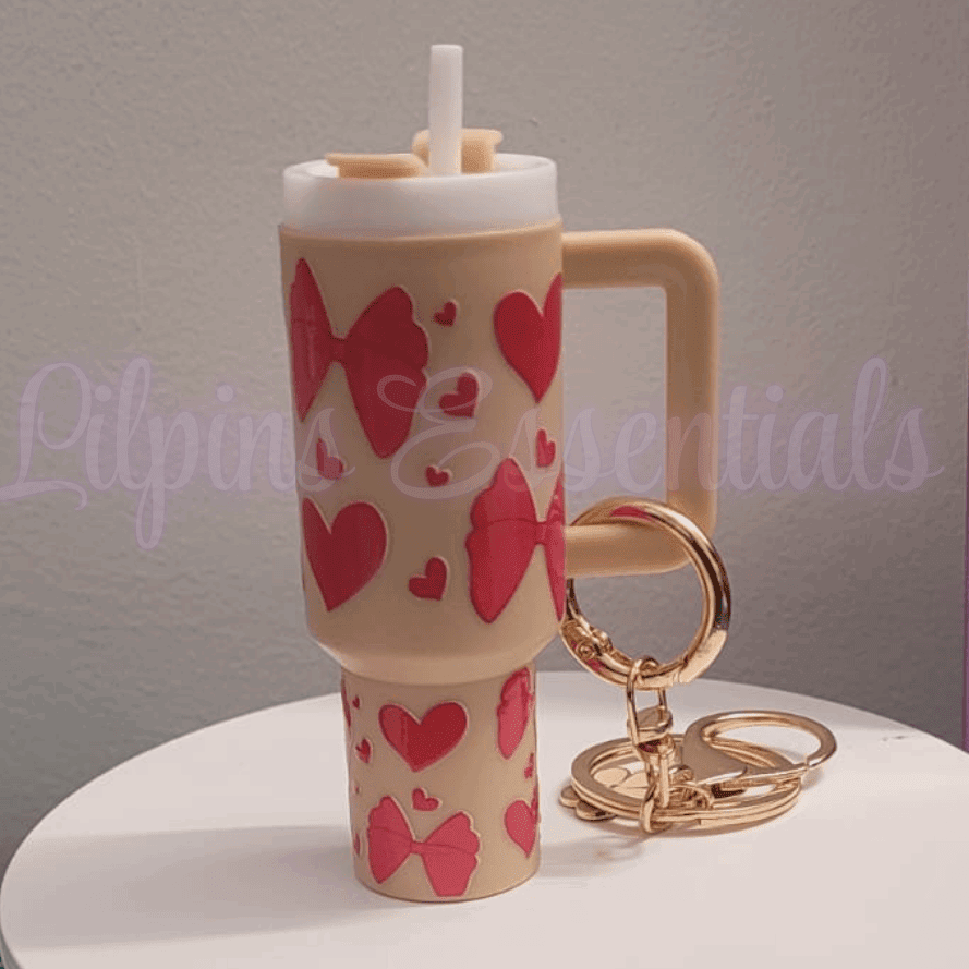 Beige mini tumbler keychain with red hearts and bows