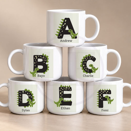 Personalised dinosaur initial polymer mug for kids with a name and green dinosaur letter design